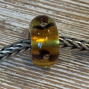 TROLLBEADS translucent flower glass bead sterling silver core retired brown tan